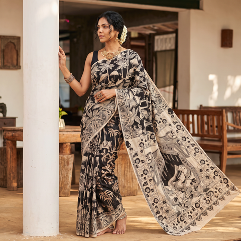Black Cotton Saree in Kalamkari Print, draped and worn by a woman, AI visual of the saree, iTokri