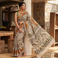 Beige Cotton Saree in Kalamkari Print, draped and worn by a woman, AI visual of the saree, iTokri