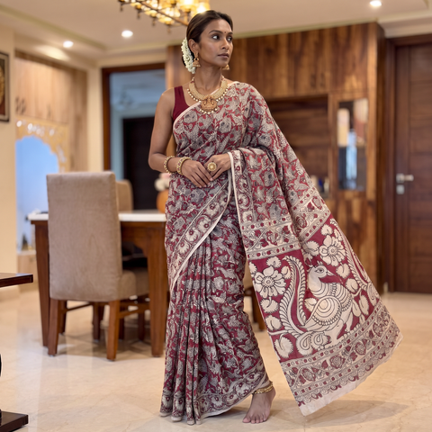 Pink Cotton Saree in Kalamkari Print, draped and worn by a woman, AI visual of the saree, iTokri