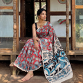 Red Cotton Saree in Kalamkari Print, draped and worn by a woman, AI visual of the saree, iTokri