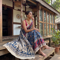 Blue Cotton Saree in Kalamkari Print, draped and worn by a woman, AI visual of the saree, iTokri