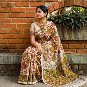 Green Cotton Saree in Kalamkari Print, draped and worn by a woman, AI visual of the saree, iTokri