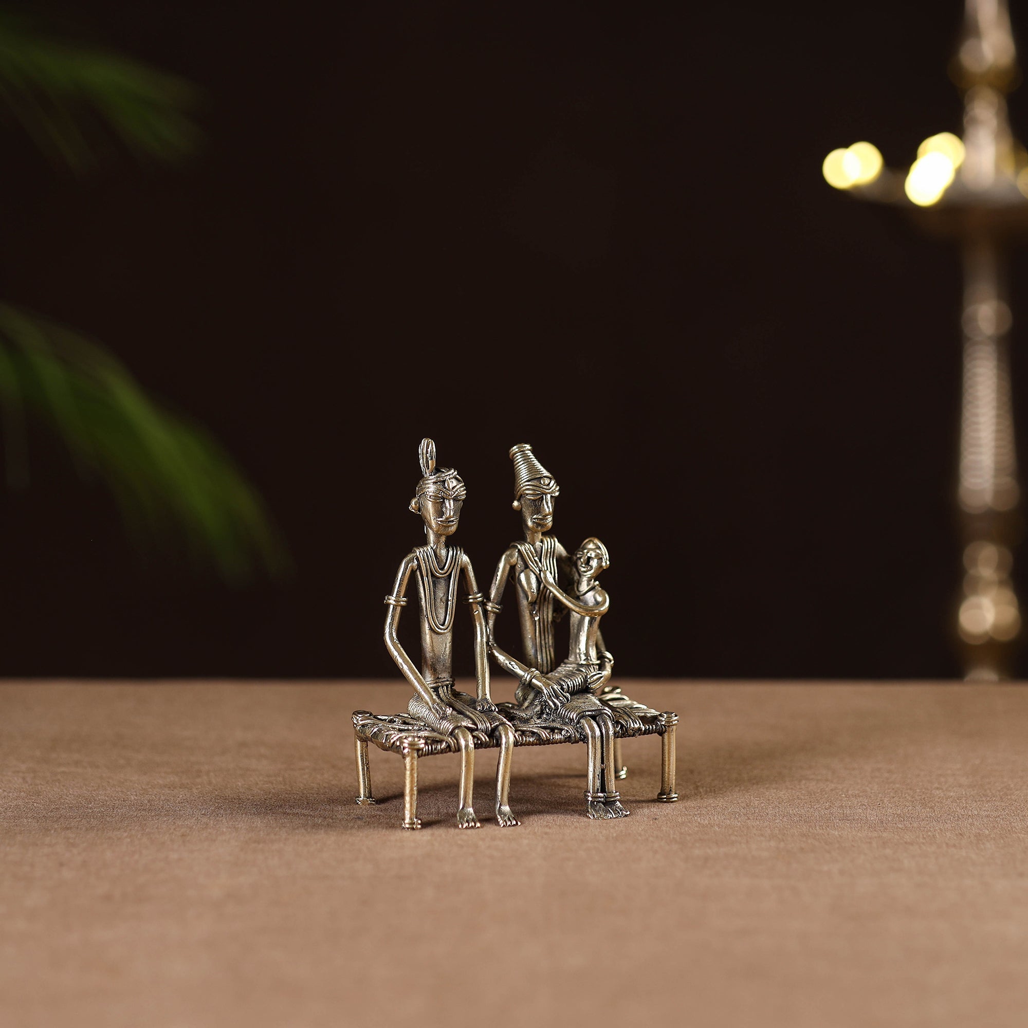 Couple child on cot - tribal odisha dokra handmade home