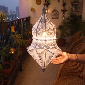 Decorative Handmade Hanging Iron Electric Lantern / Lamp, lit in a home in the evening, AI visual of the light, iTokri