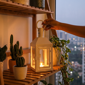 Decorative Handmade Hanging Iron Lantern (Small), lit in a home in the evening, AI visual of the light, iTokri