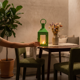 Decorative Handmade Hanging Iron Lantern (Small), lit in a home in the evening, AI visual of the light, iTokri