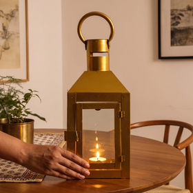 Decorative Handmade Hanging Iron Lantern (Small), lit in a home in the evening, AI visual of the light, iTokri