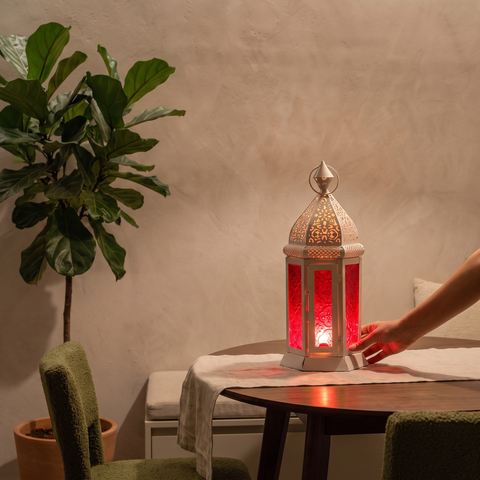 Decorative Handmade Hanging Moroccan Lantern, lit in a home in the evening, AI visual of the light, iTokri