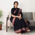 Black Dharwad Cotton Saree with Border, draped and worn by a woman, AI visual of the saree, iTokri