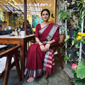 Maroon Dharwad Cotton Saree with Border, draped and worn by a woman, AI visual of the saree, iTokri