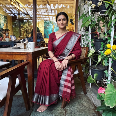Maroon Dharwad Cotton Saree with Border, draped and worn by a woman, AI visual of the saree, iTokri