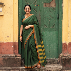 Green Dharwad Cotton Saree with Border, draped and worn by a woman, AI visual of the saree, iTokri