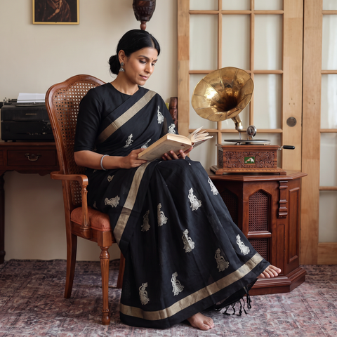 Black Dharwad Cotton Saree with Thread Buta, draped and worn by a woman, AI visual of the saree, iTokri