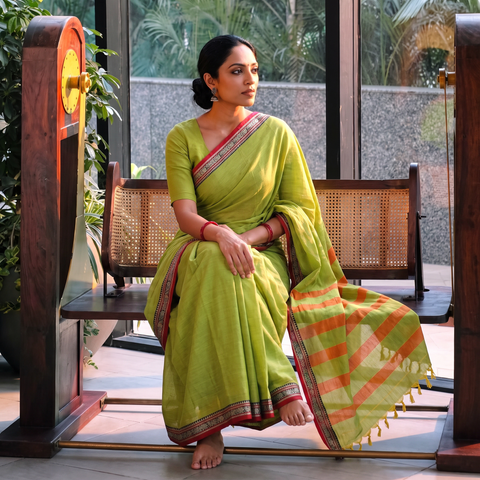 Green Dharwad Woven Mercerised Cotton Saree with Border, draped and worn by a woman, AI visual of the saree, iTokri