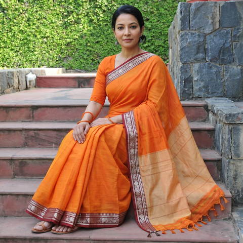 Orange Dharwad Woven Mercerised Cotton Saree with Border, draped and worn by a woman, AI visual of the saree, iTokri
