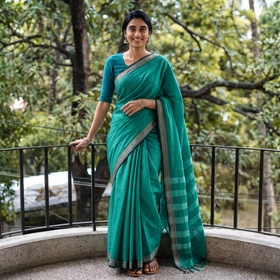 Green Dharwad Woven Mercerised Cotton Saree with Border, draped and worn by a woman, AI visual of the saree, iTokri