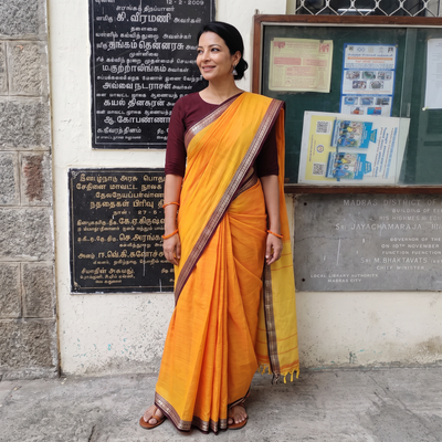 Yellow Dharwad Woven Mercerised Cotton Saree with Border, draped and worn by a woman, AI visual of the saree, iTokri