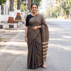 Brown Dharwad Woven Mercerised Cotton Saree with Border, draped and worn by a woman, AI visual of the saree, iTokri
