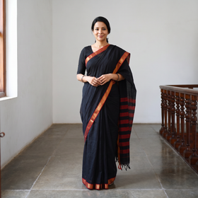 Black Dharwad Woven Mercerised Cotton Saree with Border, draped and worn by a woman, AI visual of the saree, iTokri