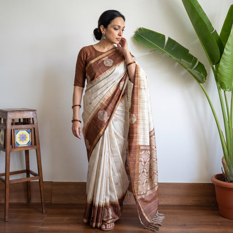 Beige Dupion Raw Silk Bhagalpuri Pure Handwoven Saree with Zari Border, draped and worn by a woman, AI visual of the saree, iTokri