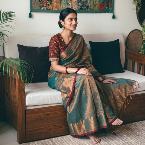 Green Fine Tissue Zari Bengal Saree with Embroidered Blouse, draped and worn by a woman, AI visual of the saree, iTokri