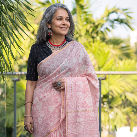 Peach floral hand block print mulberry silk Sanganeri saree, draped and worn by a woman, by artisan Prem Dosaya, AI visual of the saree, iTokri