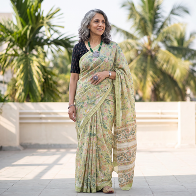 Green floral hand block print mulberry silk Sanganeri saree, draped and worn by a woman, by artisan Prem Dosaya, AI visual of the saree, iTokri