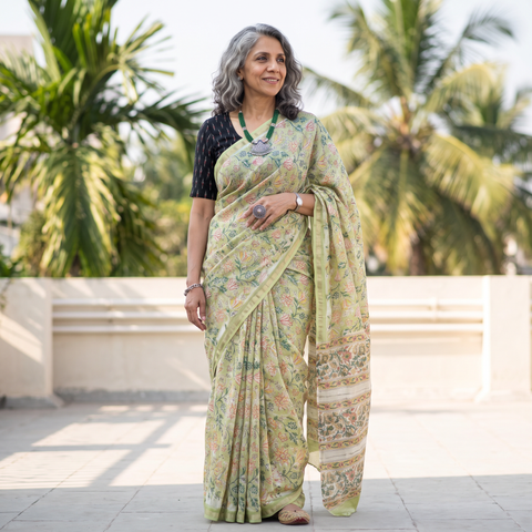Green floral hand block print mulberry silk Sanganeri saree, draped and worn by a woman, by artisan Prem Dosaya, AI visual of the saree, iTokri