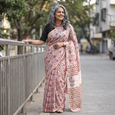 Pink floral hand block print mulberry silk Sanganeri saree, draped and worn by a woman, by artisan Prem Dosaya, AI visual of the saree, iTokri