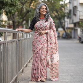 Pink floral hand block print mulberry silk Sanganeri saree, draped and worn by a woman, by artisan Prem Dosaya, AI visual of the saree, iTokri