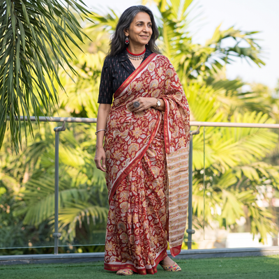Red floral hand block print mulberry silk Sanganeri saree, draped and worn by a woman, by artisan Prem Dosaya, AI visual of the saree, iTokri