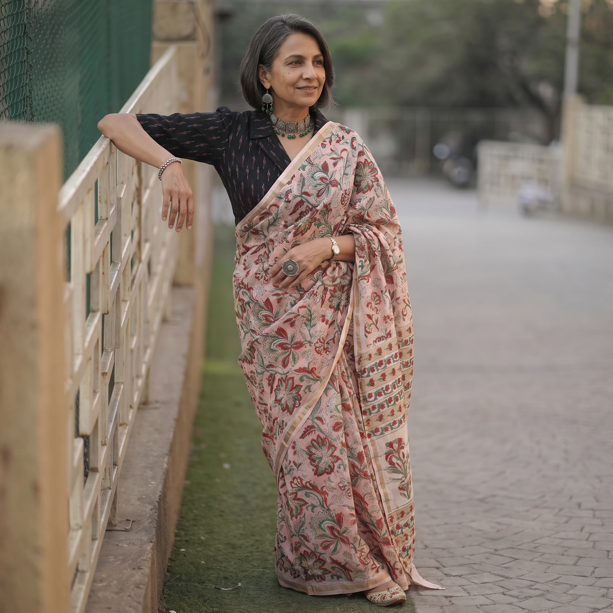 Pink floral hand block print mulberry silk Sanganeri saree, draped and worn by a woman, by artisan Prem Dosaya, AI visual of the saree, iTokri