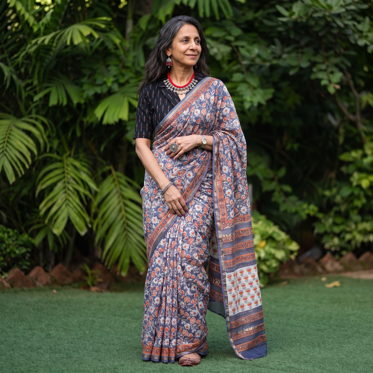Blue floral hand block print mulberry silk Sanganeri saree, draped and worn by a woman, by artisan Prem Dosaya, AI visual of the saree, iTokri