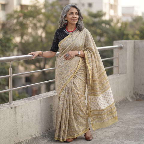 Yellow floral hand block print mulberry silk Sanganeri saree, draped and worn by a woman, by artisan Prem Dosaya, AI visual of the saree, iTokri