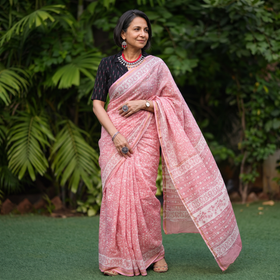 Pink floral hand block print mulberry silk Sanganeri saree, draped and worn by a woman, by artisan Prem Dosaya, AI visual of the saree, iTokri