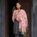 Pink Floral Sanganeri Print Pure Merino Wool Handwoven Shawl, worn by a model, AI visual of the shawl, iTokri