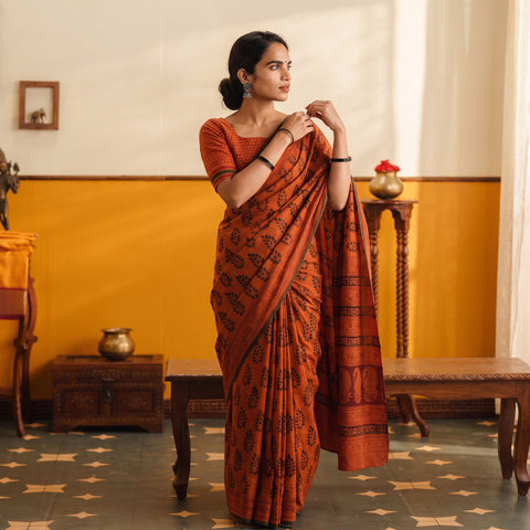 Orange Gamthi Hand Block Print Pure Mul Cotton Saree with Blouse Piece, draped and worn by a woman, AI visual of the saree, iTokri
