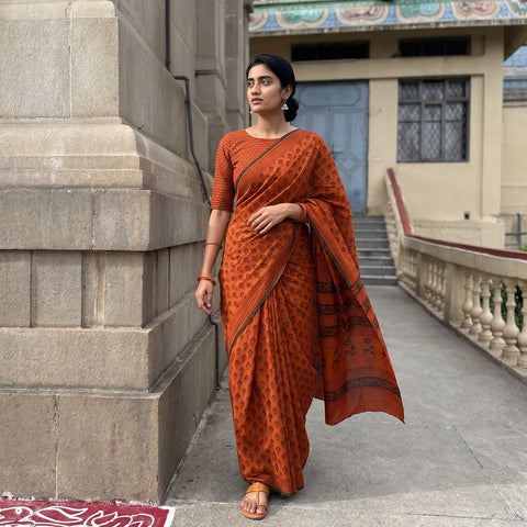 Orange Gamthi Hand Block Print Pure Mul Cotton Saree with Blouse Piece, draped and worn by a woman, AI visual of the saree, iTokri