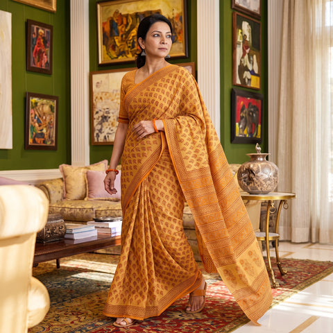 Yellow Gamthi Hand Block Print Pure Mul Cotton Saree with Blouse Piece, draped and worn by a woman, AI visual of the saree, iTokri