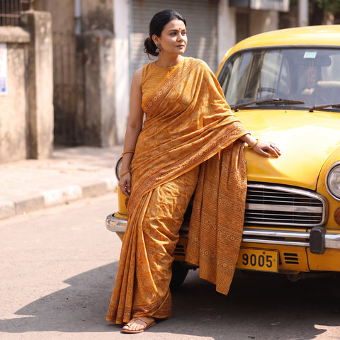 Yellow Gamthi Hand Block Print Pure Mul Cotton Saree with Blouse Piece, draped and worn by a woman, AI visual of the saree, iTokri