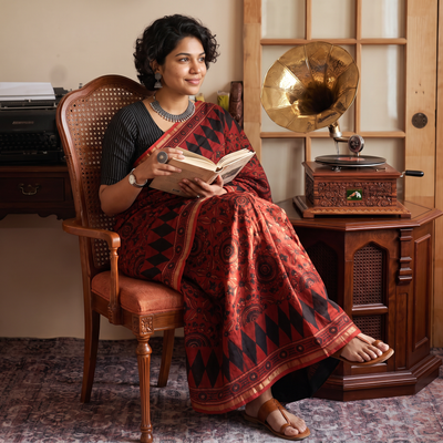 Red Ghicha Pallu Chanderi Silk Natural Dyed Ajrakh Print Saree, draped and worn by a woman, AI visual of the saree, iTokri