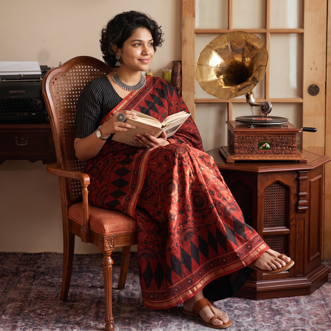Red Ghicha Pallu Chanderi Silk Natural Dyed Ajrakh Print Saree, draped and worn by a woman, AI visual of the saree, iTokri