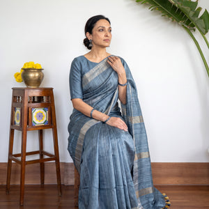 Blue Ghicha Tussar Silk Bhagalpuri Pure Handwoven Saree with Zari Border, draped and worn by a woman, AI visual of the saree, iTokri