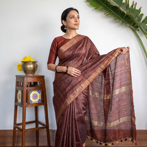 Brown Ghicha Tussar Silk Bhagalpuri Pure Handwoven Saree with Zari Border, draped and worn by a woman, AI visual of the saree, iTokri