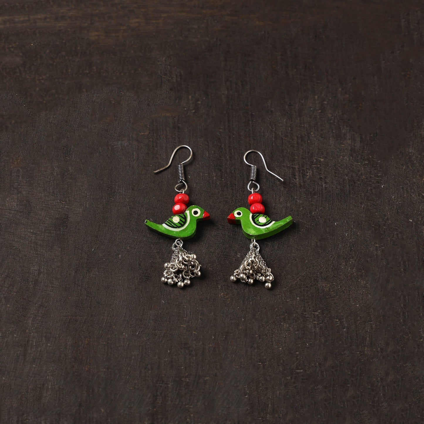 Avira german silver jhumki earrings with wooden bird