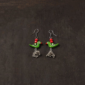 Avira german silver jhumki earrings with wooden bird