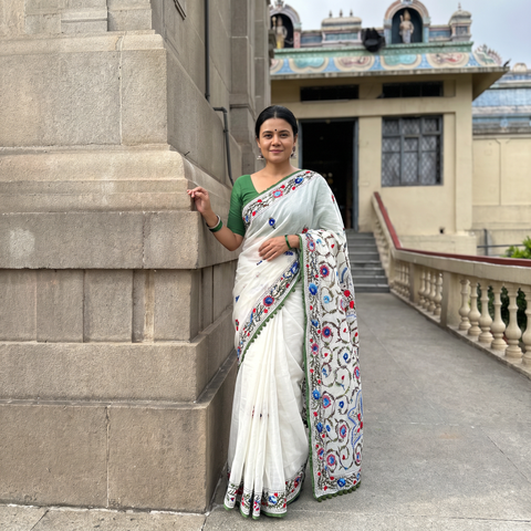 White and Green Hand Embroidered Chapa Work Silk Cotton Saree, draped and worn by a woman, AI visual of the saree, iTokri