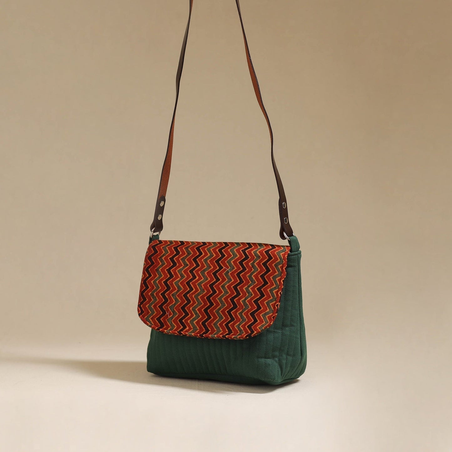 Handcrafted quilted ajrakh block printed fabric sling bag