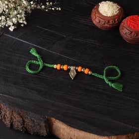 Handcrafted tribal dokra brass thread rakhi 24