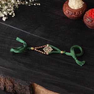 Handcrafted tribal dokra brass thread rakhi 35